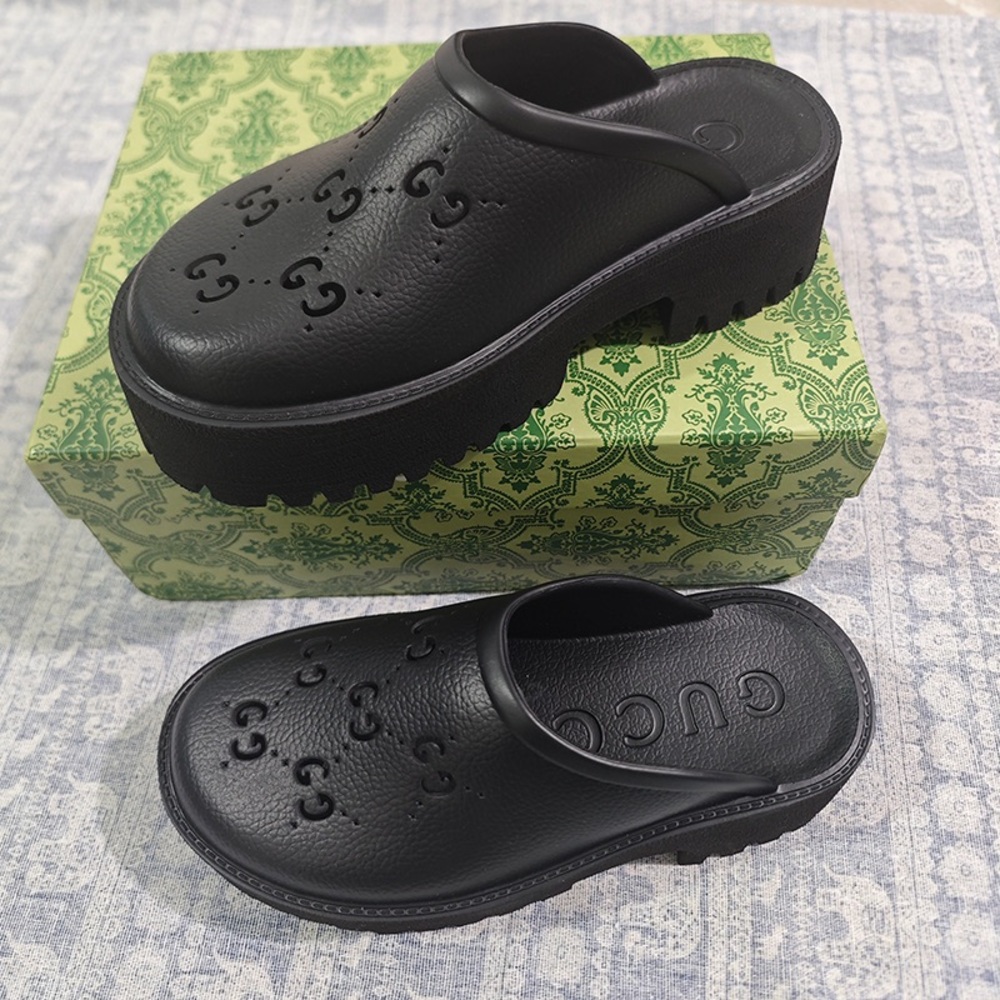 Gucci black perforated GG rubber platform shoes